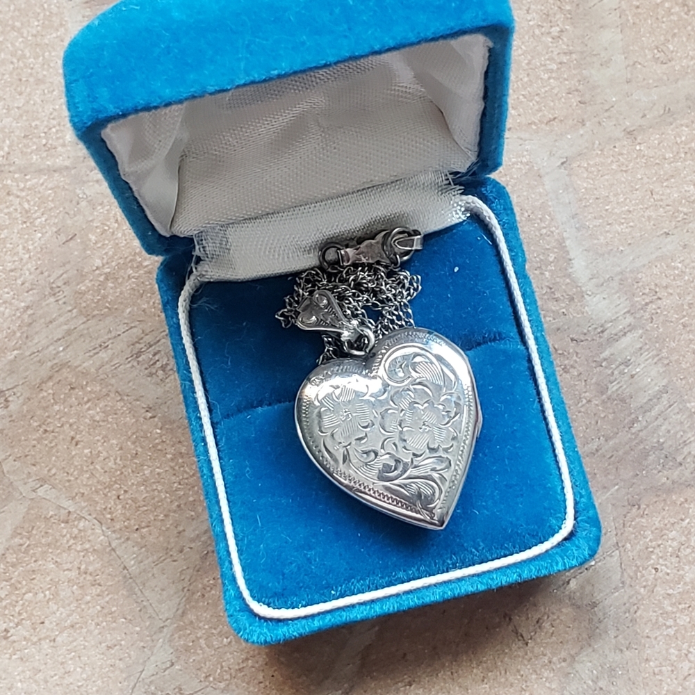Gorgeous antique sterling silver embossed heart necklace.